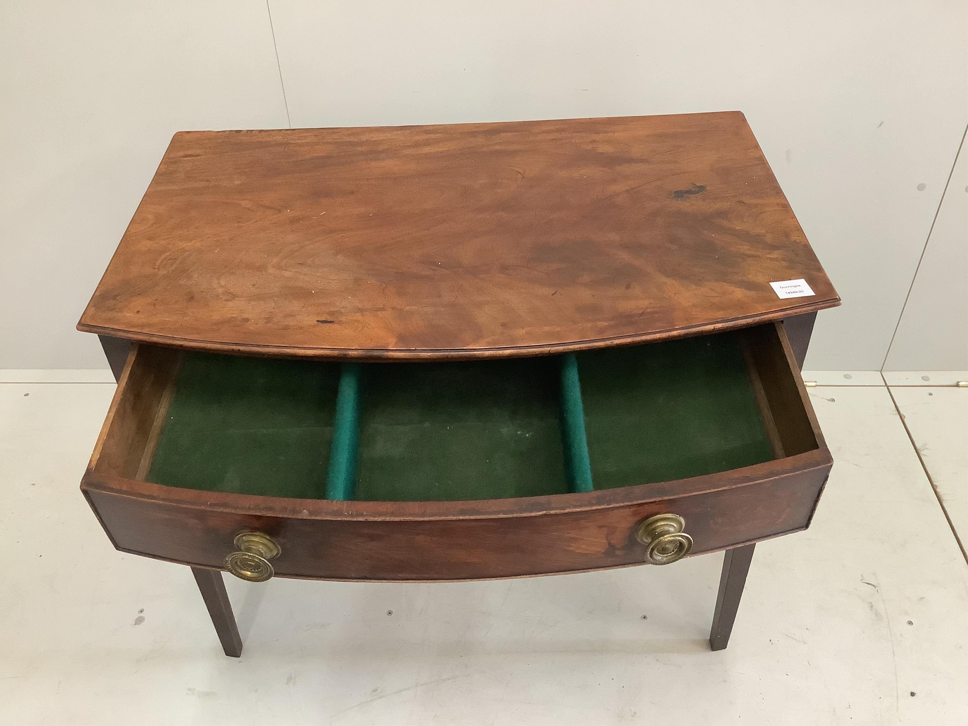 A George III mahogany bowfront side table, width 85cm, depth 53cm, height 71cm. Condition - fair